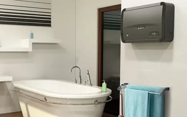 Tankless water heater mounted on a wall near a bathtub